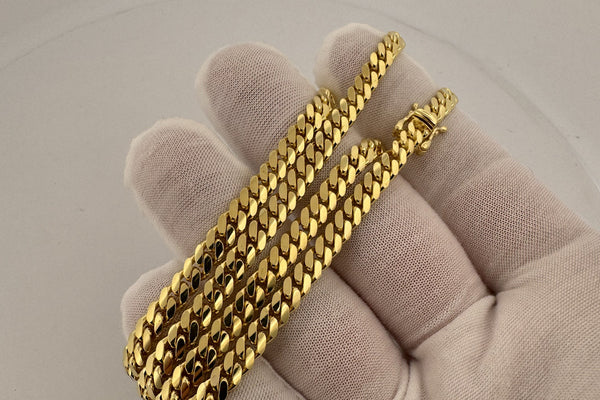 14K gold Cuban link chain on a jewelry scale showing gram weight - Ott Family Jewelry melt value guide