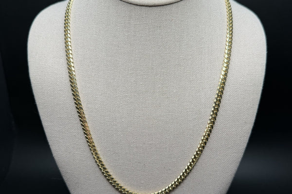 Solid 14K gold Cuban link chain close-up showing link detail