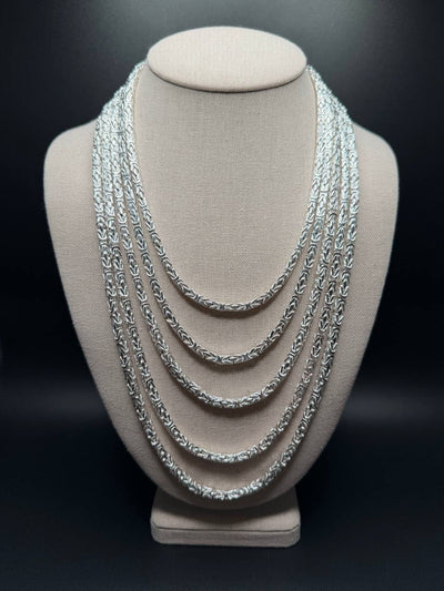 4mm solid 925 sterling silver Byzantine chain — 18" to 26" lengths stacked on bust, front view — Ott Family Jewelry
