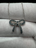 18” Silver Chain & 1/4ctw Natural Blue Diamond Bow Pendant 2.8g