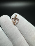 3/4" 10k Rose Gold Heart with Natural Diamond Solitaire Center and White Enamel 1.33g